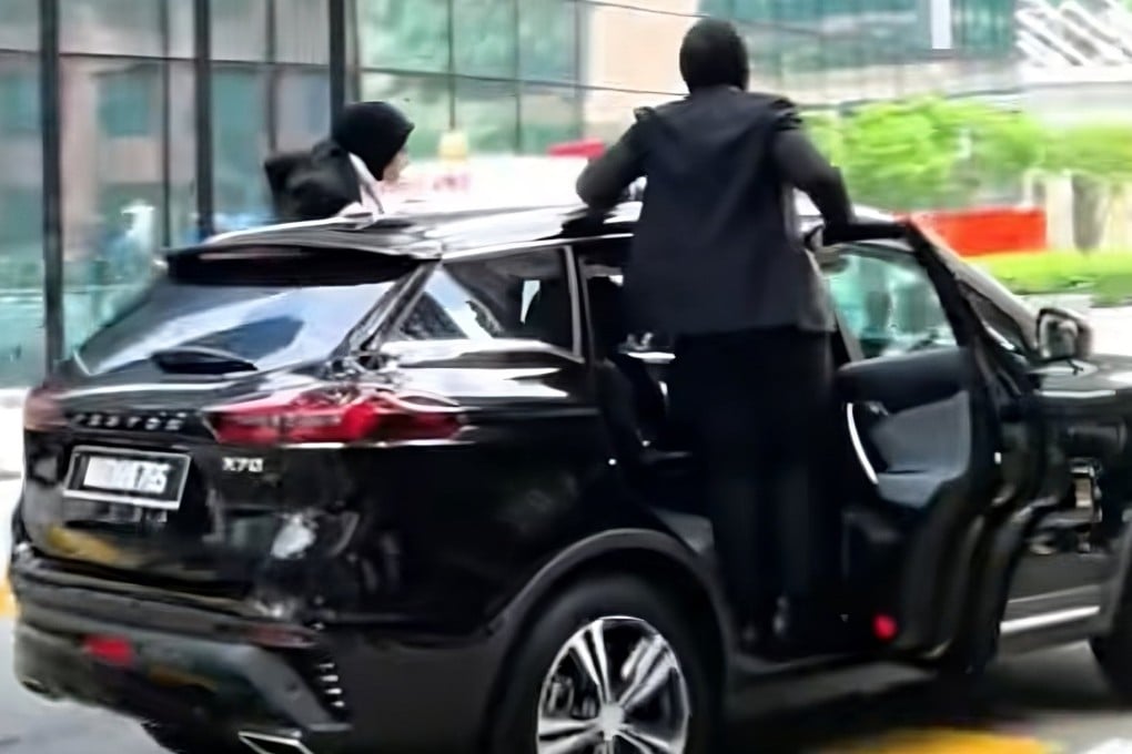 A still from social media footage shows the female bodyguards after leaping onto a moving SUV at last month’s Asean summit in Kuala Lumpur, Malaysia. Photo: TikTok/lang131499