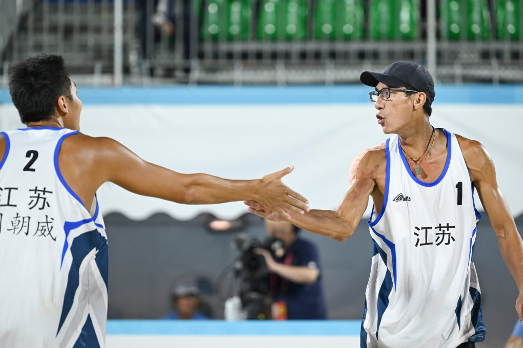 Jiangsu teammates Wu Jiaxin (right) and Zhou Chaowei celebrate a point during their men’s final against Li Zhuoxin and Xue Tao of Liaoning. Photo: Xinhua
