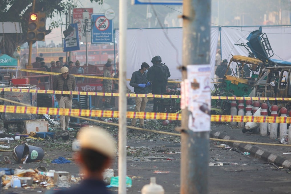 Security personnel and members of a police forensic team work on Tuesday at the site of an explosion near the historic Red Fort in New Delhi. Photo: Reuters