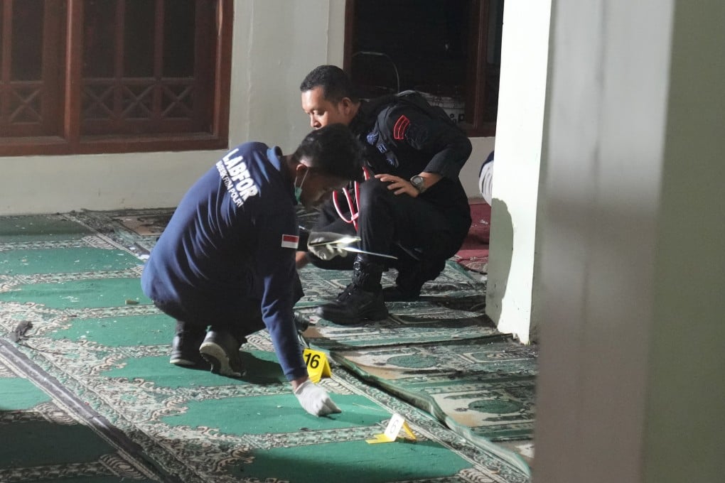 Members of Indonesian Police bomb squad inspect the mosque where explosions went off at a high school compound in Jakarta, Indonesia last week. Photo: AP