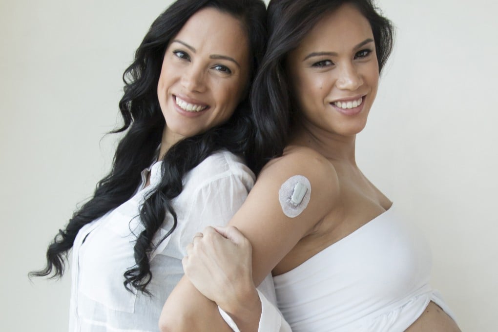 Michelle Hale (right), pictured here close to term and wearing her continuous glucose monitor and insulin pump, with her twin Anna Teslikova James (left), who does not have diabetes, in November 2016. Photo: Michelle Hale