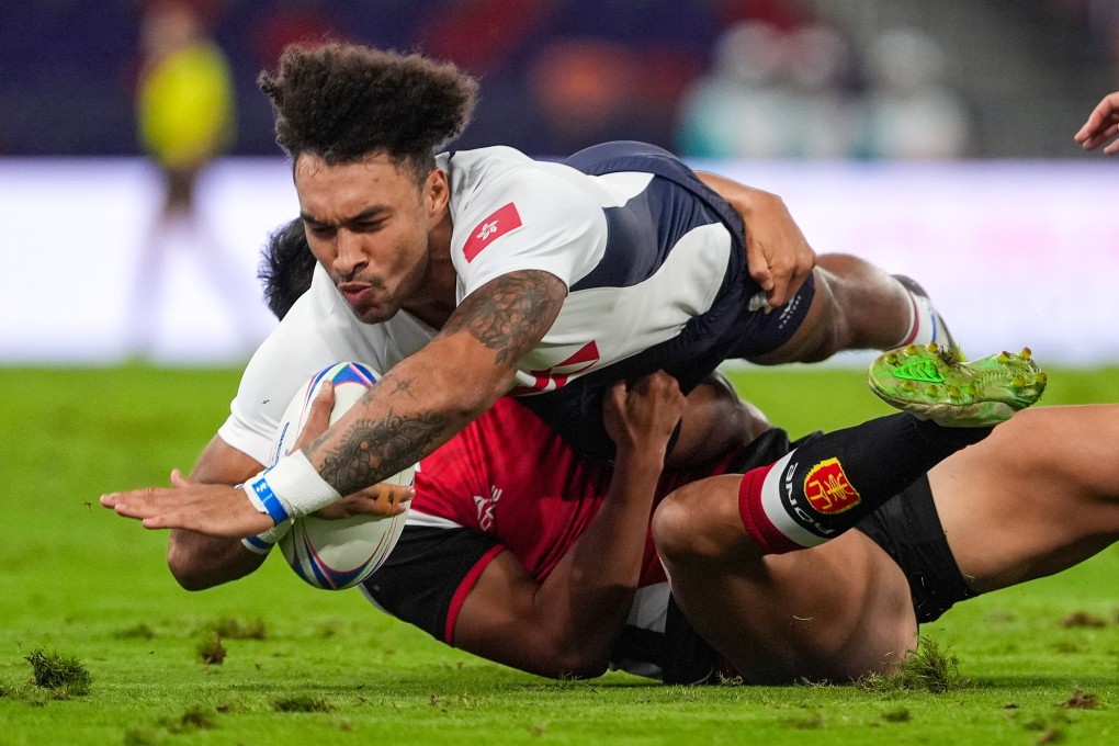 Hong Kong’s Max Denmark dives through a tackle in his side’s opening rugby sevens game against Shandong. Photo: Elson Li
