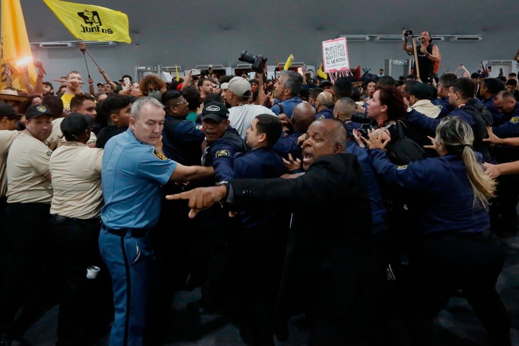 Security personnel clash with indigenous people and students as they storm the venue during the Cop30 UN Climate Change Conference in Belem, Para State, Brazil, on November 11. The clash underscored frustration among indigenous groups who demand forest protection. Photo: AFP