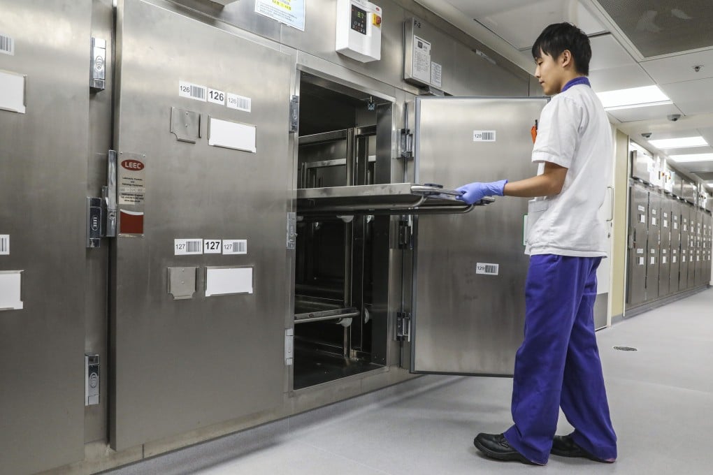 A patient care assistant works at the mortuary at Queen Mary Hospital in Pok Fu Lam, on September 18, 2018. Photo: K. Y. Cheng
