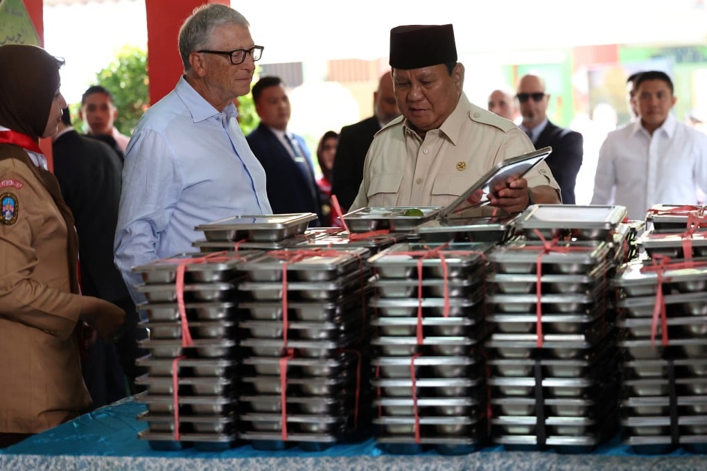 Bill Gates (left) and Indonesian President Prabowo Subianto inspect meal boxes during a visit to a Jakarta school to inspect the free nutritious meals programme in May. Photo: Reuters