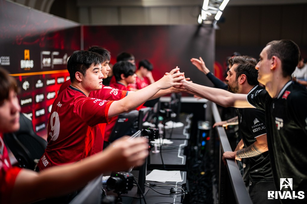 TYLOO players (left) shake hands with their paiN Gaming rivals after their defeat. Photos: BLAST/Luc Bouchon