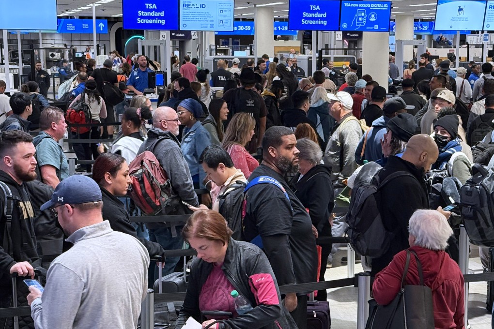 Travellers wait in a TSA security screening line at Orlando International Airport on Wednesday. Photo: SOPA Images via ZUMA Press Wire/dpa