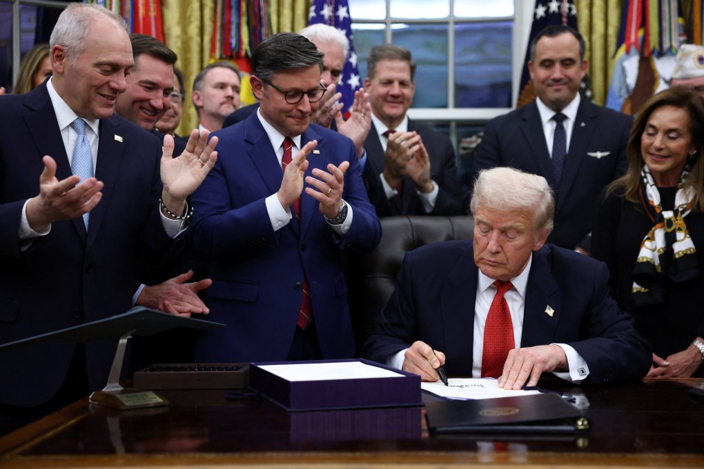 US President Donald Trump signs the funding bill to end the US government shutdown. Photo: Reuters