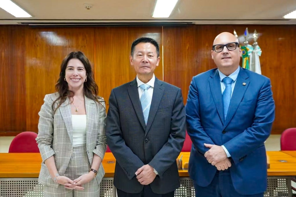 A photo issued by the China Securities Regulatory Commission shows chairman Wu Qing (centre) with officials from France and Brazil. Photo: Handout