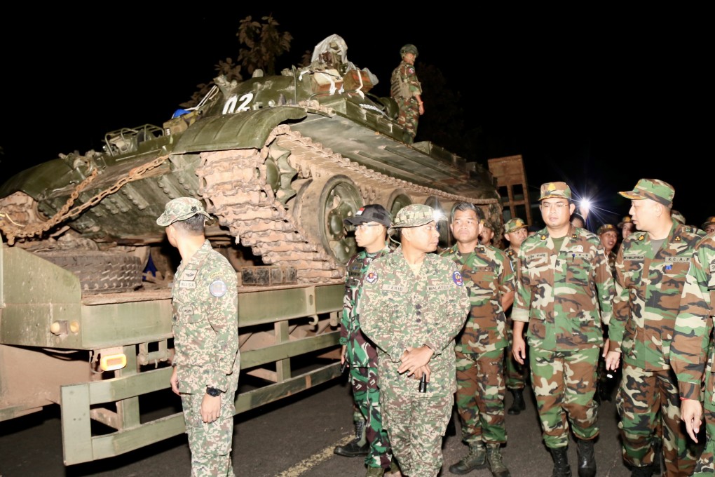 Cambodian soldiers stand on a tank in Preah Vihear province near the border with Thailand. Photo: EPA/Agence Kampuchea Presse