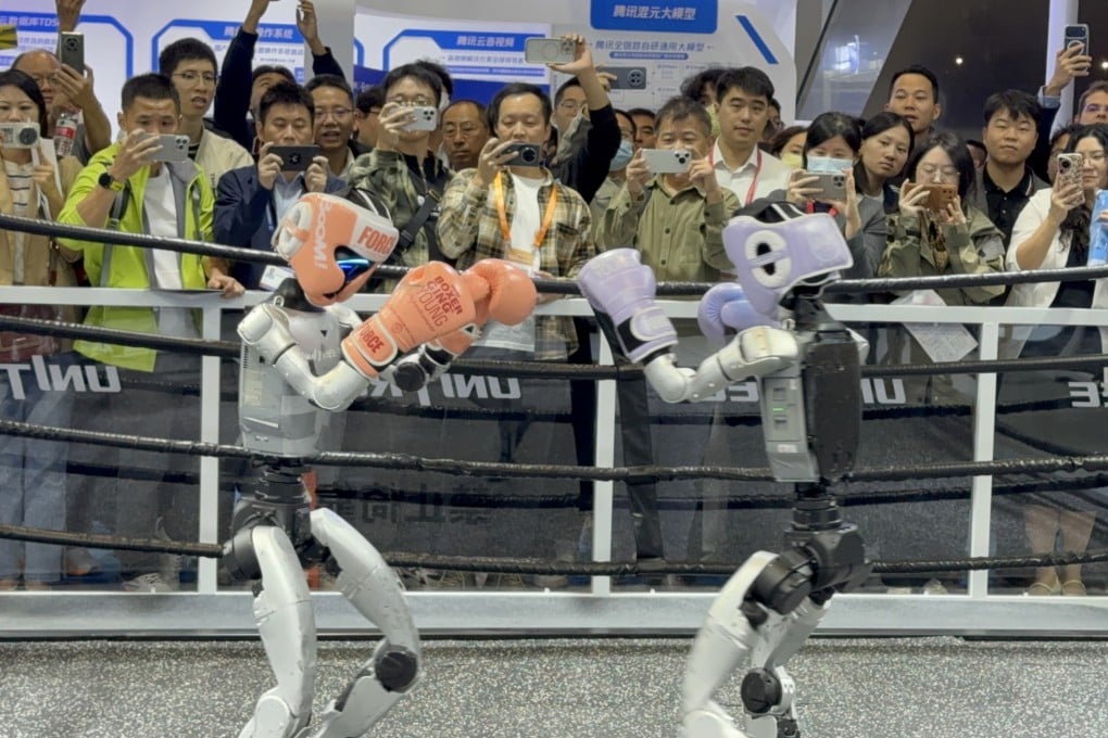 China Hi-Tech Fair attendees are regaled by a kickboxing match between humanoid robots from Unitree Robotics. Photo: Iris Deng