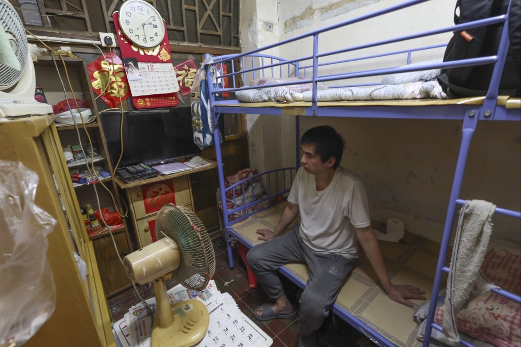 A resident sits in front of a fan in a subdivided flat with neither windows nor air conditioning, during a very hot day in Hong Kong. Extreme weather conditions are affecting many people’s mental health. Photo: Dickson Lee