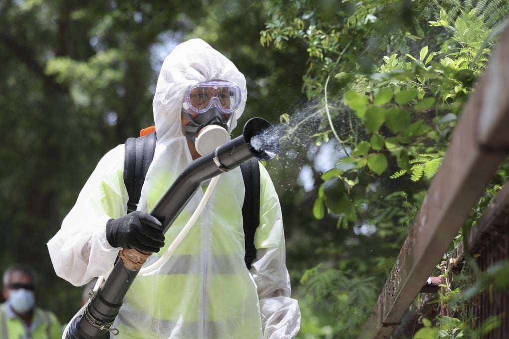 Staff from the Food and Environmental Hygiene Department carry out mosquito control works. Photo: Karma Lo