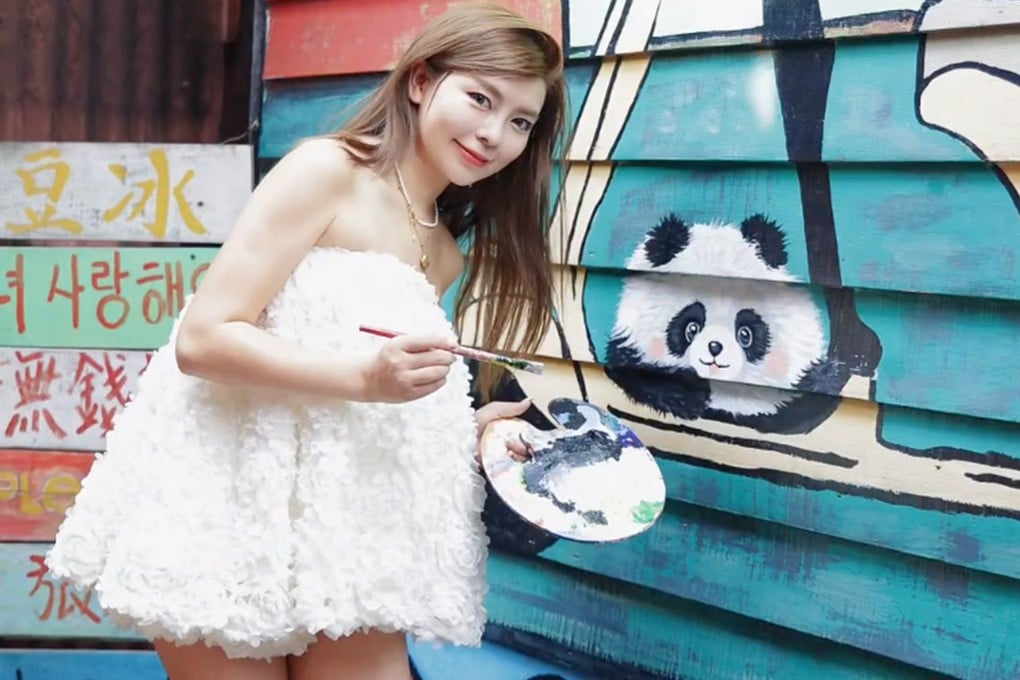 Shen Shishi with her finished painting of a panda. Photo: Handout