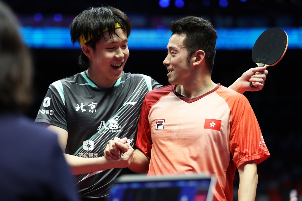 Beijing player Wang Chuqin (left) greets Hong Kong player Wong Chun-ting after their National Games match in Macau on Wednesday. Photo: Xinhua