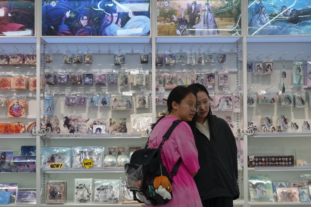 Women near shelves of merchandise for danmei stories in a comic store in Beijing. China is cracking down on stories about men in love. Photo: AP