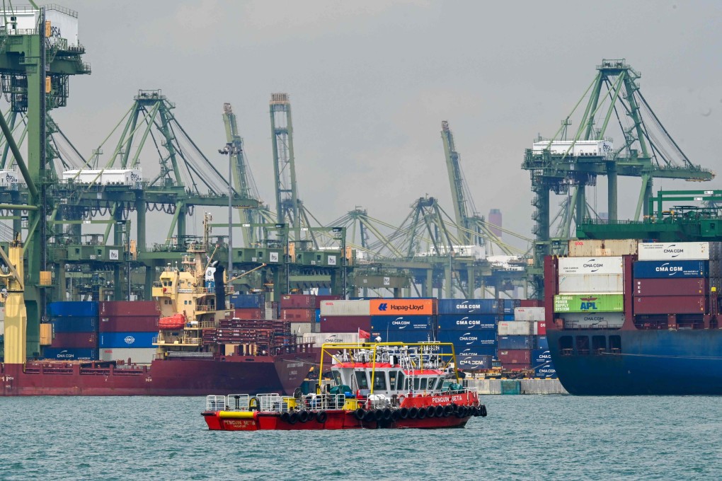 Vessels with shipping containers are seen at Pasir Panjang port terminal in Singapore in October. The country supplied more than 1 million tonnes of alternative bunker fuels in 2024. Photo: AFP