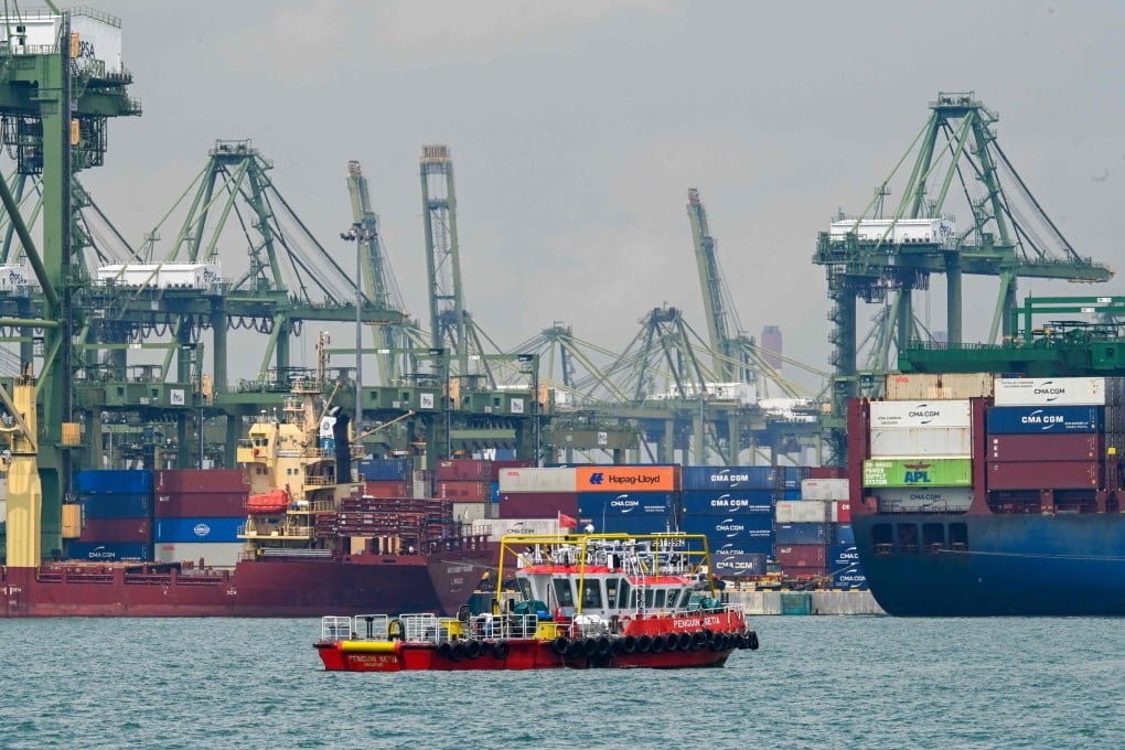 Vessels with shipping containers are seen at Pasir Panjang port terminal in Singapore in October. The country supplied more than 1 million tonnes of alternative bunker fuels in 2024. Photo: AFP