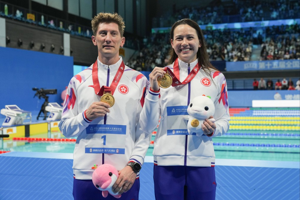 Hong Kong swimmer Siobhan Haughey (right) alongside coach Tom Rushton after winning the women’s 200m freestyle final at the National Games. Photo: Eugene Lee
