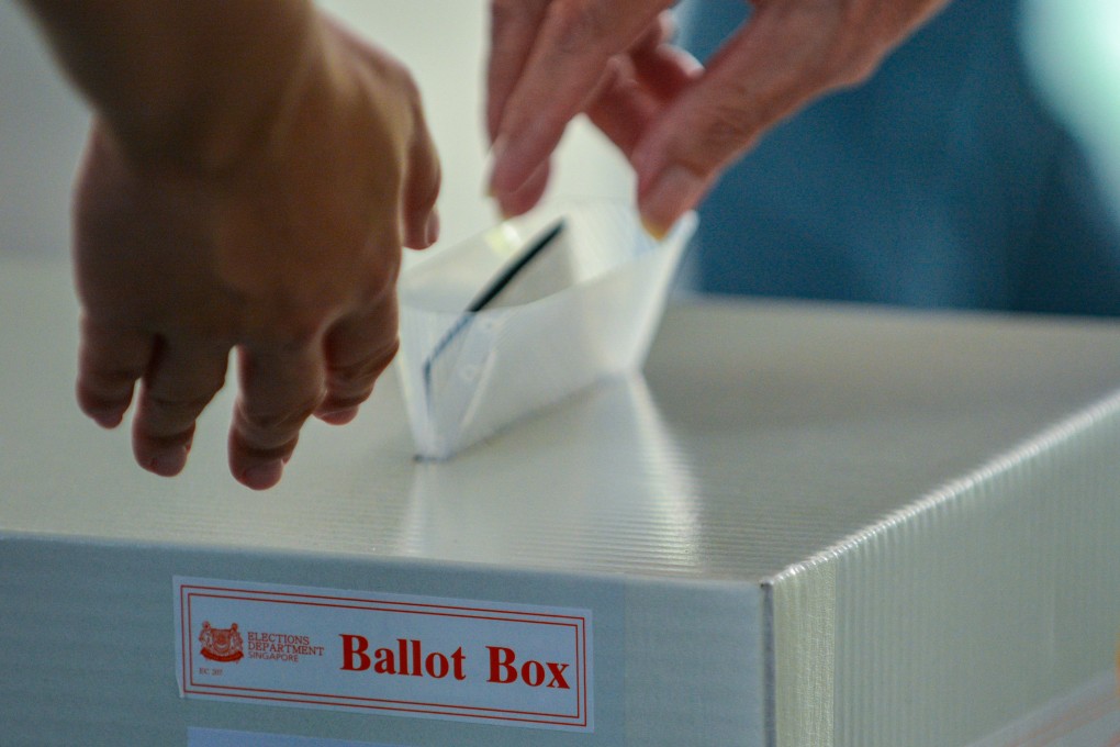 A voter casting a ballot at a polling station in Singapore at the May 3 general election. Photo: EPA-EFE