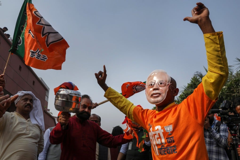 Bharatiya Janata Party supporters celebrate their party’s lead in the Bihar state election results in New Delhi, India on Friday. Photo: EPA