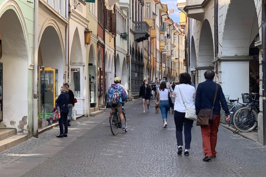 People at a street in Bolzano, capital of the South Tyrol region. Italy’s northernmost province is a particularly popular holiday destination for German and Austrian tourists. Photo: EPA-EFE