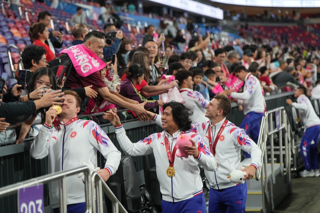 Liam Herbert (left) and Fong Kit-fung (centre) show off their National Games medals. Photo: Sam Tsang