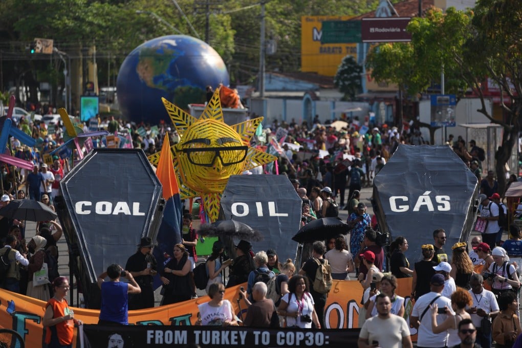 Climate activists protest with coffins that read coal, oil and gas during the C0-30 UN climate summit on Saturday in Belem, Brazil. Photo: AP