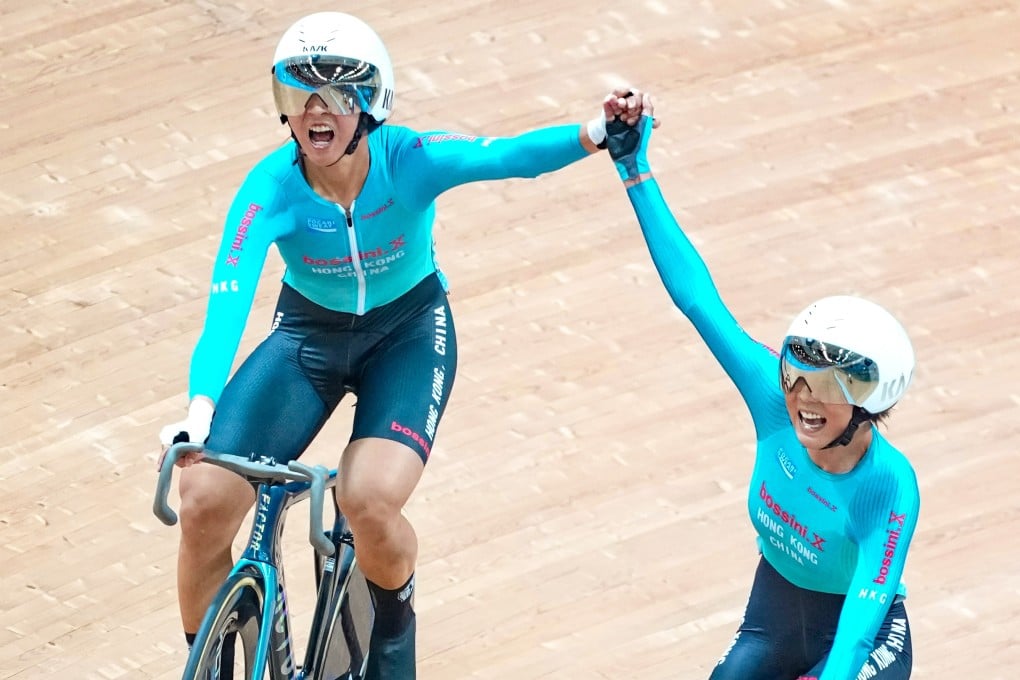 Hong Kong cyclists Ceci Lee (left) and Chloe Leung celebrate after winning the Madison race at the National Games on Sunday. Photo: Karma Lo