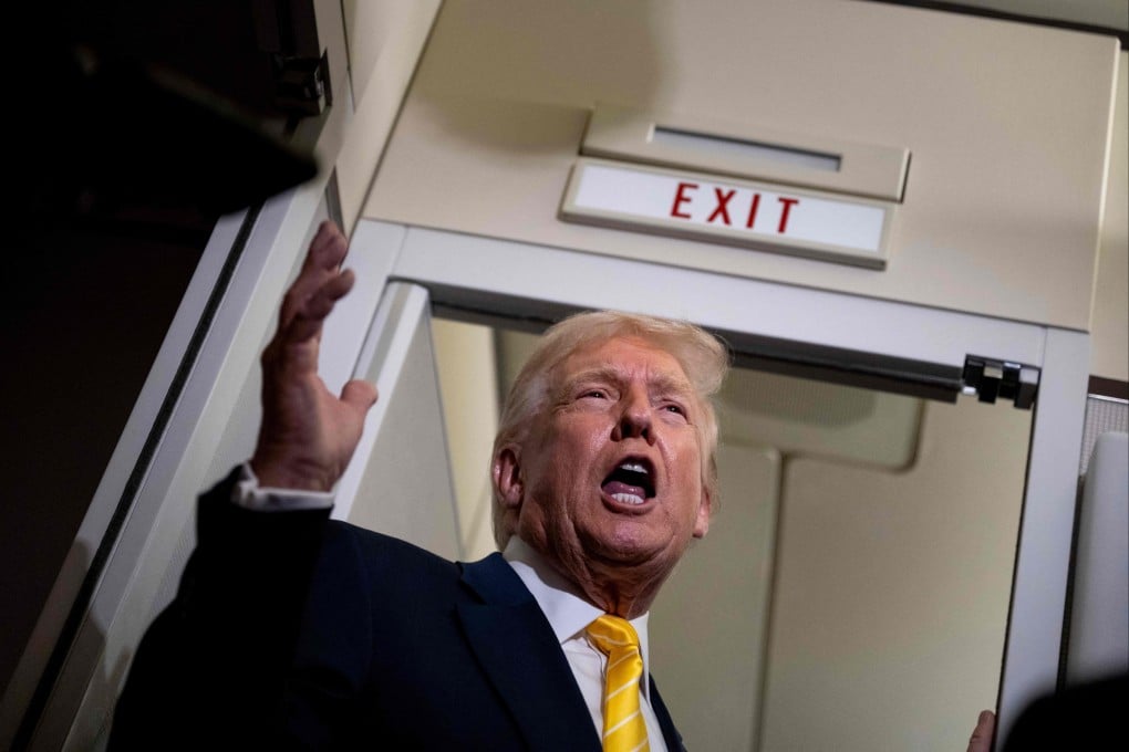 US President Donald Trump speaks to the media aboard Air Force One on Friday. Photo: Getty Images via AFP