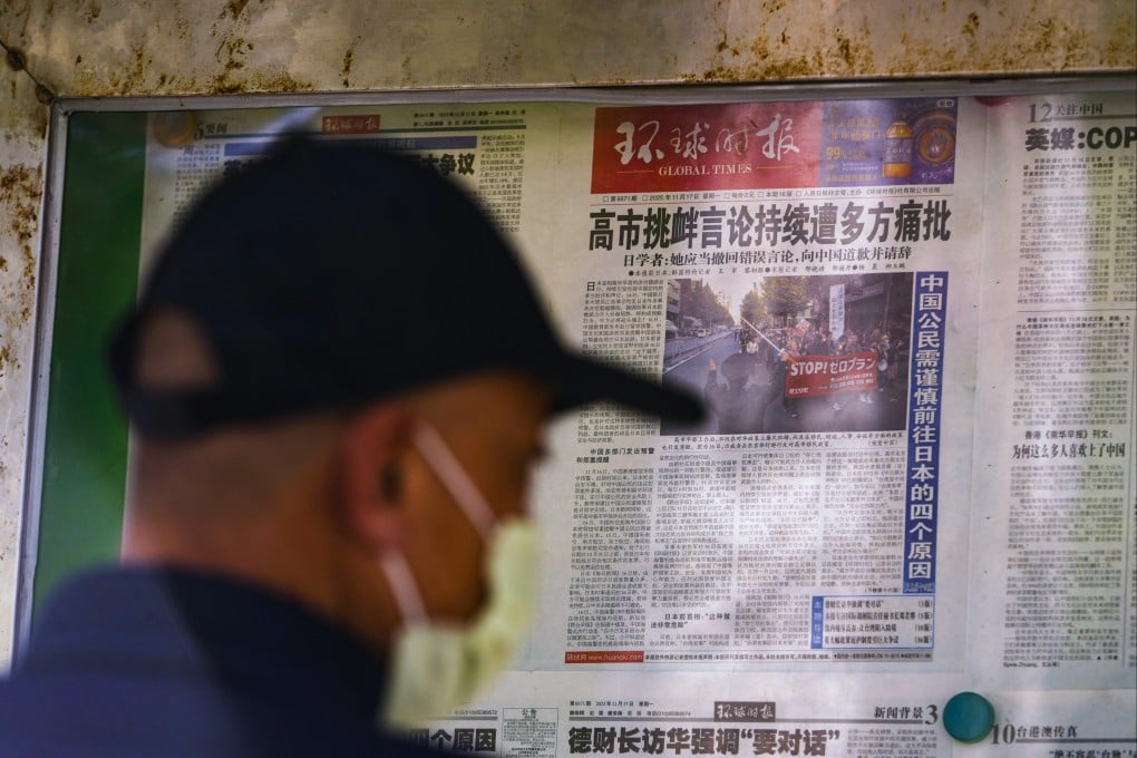 Local newspapers report on Japanese Prime Minister Sanae Takaichi’s recent remarks on Taiwan at a newsstand in Beijing on Monday. Photo: AP