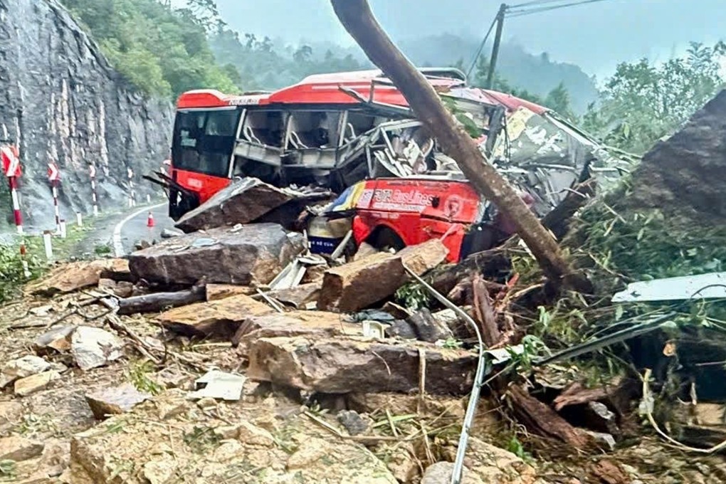 A passenger bus is crushed by a landslide on Khanh Le pass in Khanh Hoa province, Vietnam late on Sunday. Photo: VNExpress/AP