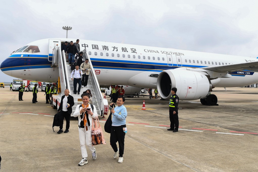 Passengers step off a C919 aircraft operated by China Southern Airlines at Haikou Meilan International Airport in Haikou, south China’s Hainan Province. Photo: Xinhua