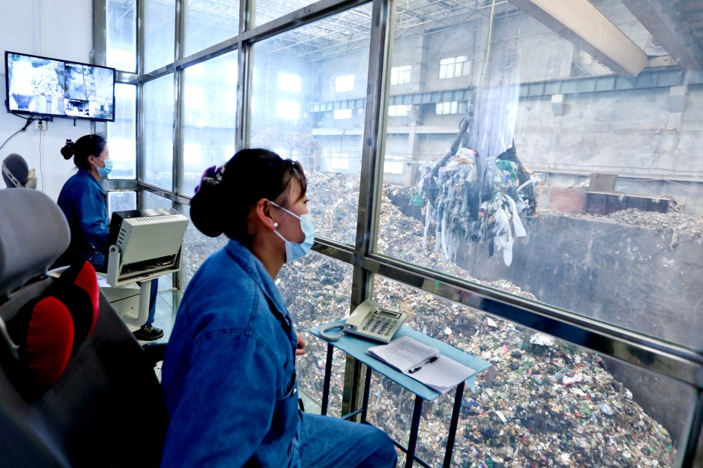 Staff work at a garbage-incinerator power station in China. Photo: Future Publishing via Getty Images