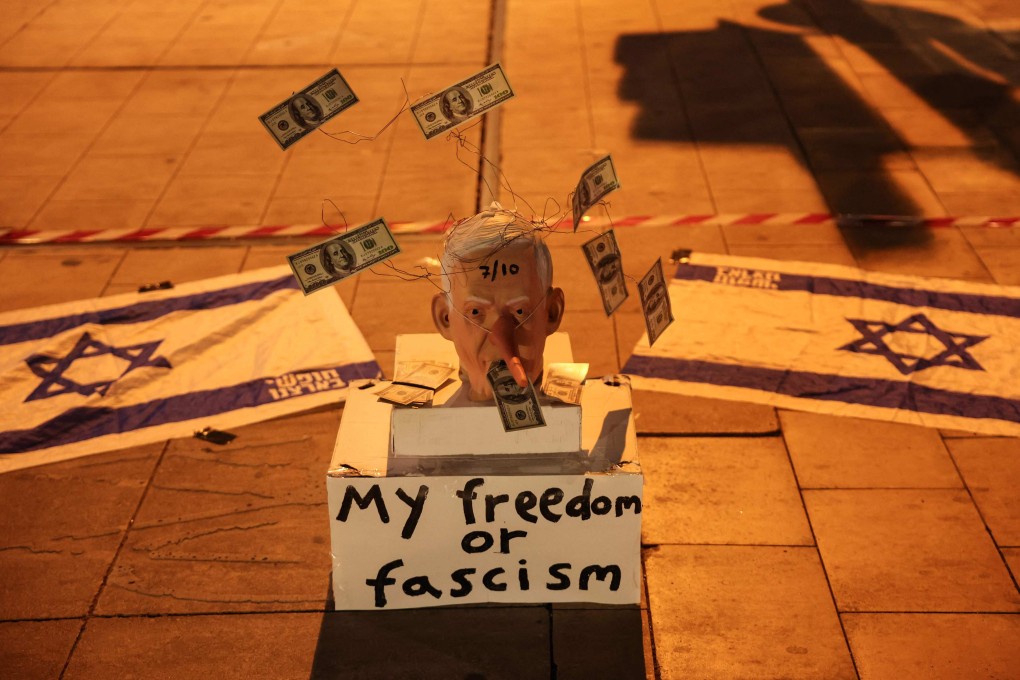 A mask mocking Israeli Prime Minister Benjamin Netanyahu is placed on the street in Tel Aviv during a demonstrate against him and in support of establishing a state commission of inquiry into Hamas’ October 7, 2023 attacks. Photo: AFP