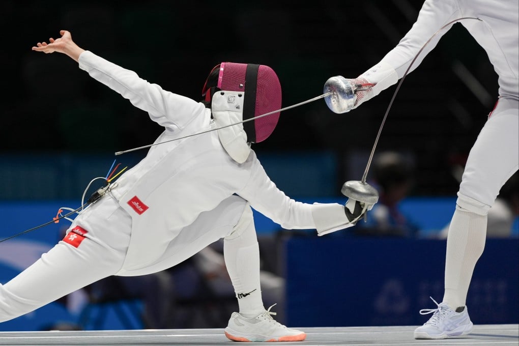 Hong Kong’s Wu Haidi (left) in action during the women’s team epee bronze medal match against Beijing. Photo: Eugene Lee