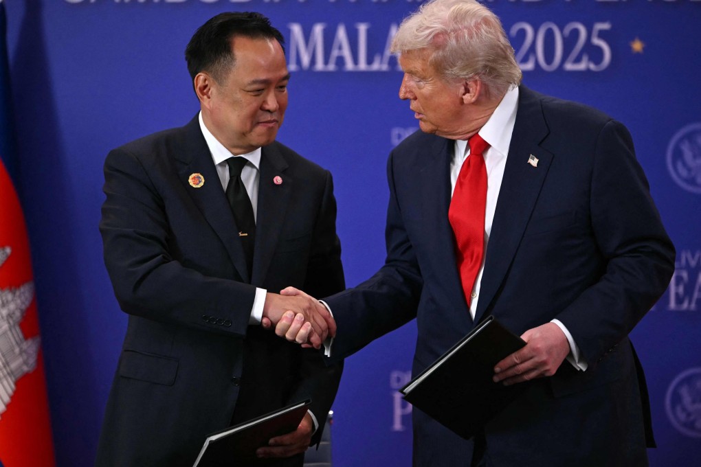 US President Donald Trump shakes hands with Thailand’s Prime Minister Anutin Charnvirakul (left) during the ceremonial signing of a Thai-Cambodia ceasefire agreement in Kuala Lumpur on October 26. Photo: AFP