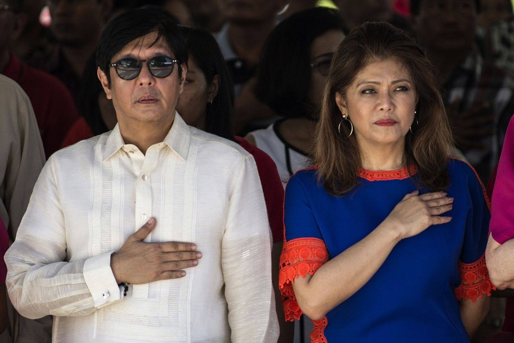 Ferdinand “Bongbong” Marcos Jnr and his sister Imee pictured during a wreath-laying ceremony to mark their late father’s 100th birthday in 2017. Photo: AFP