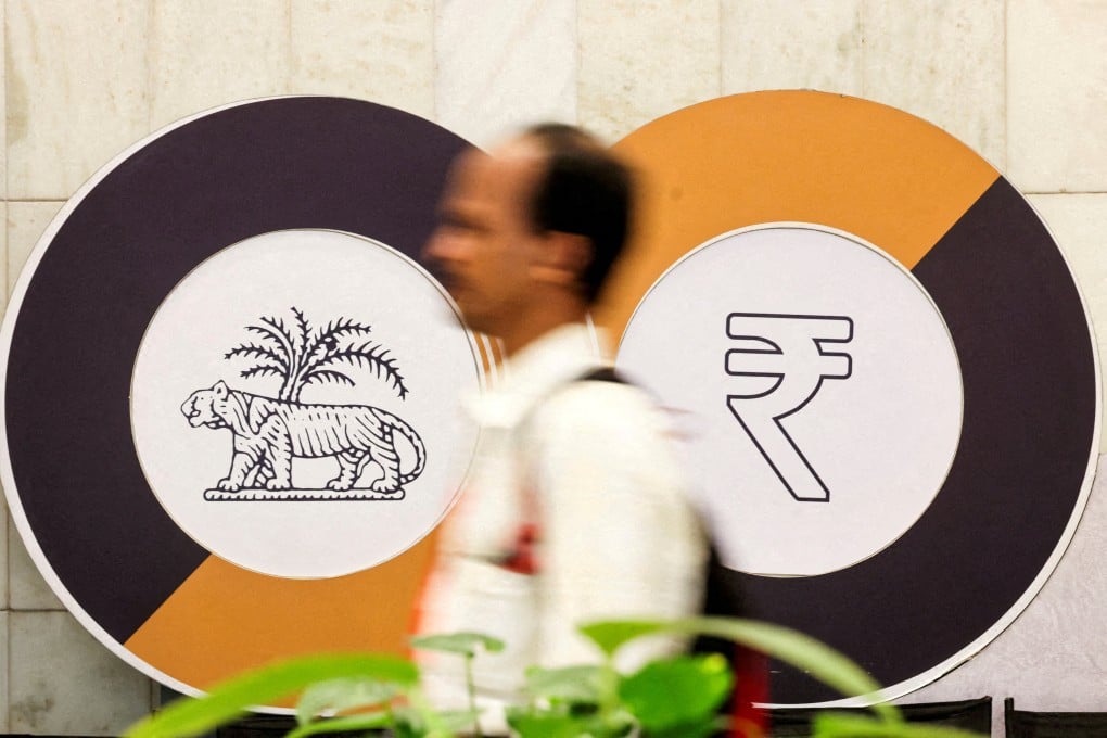 A man walks past logos of the Reserve Bank of India and the Indian rupee inside the central bank’s headquarters in Mumbai, India. Photo: Reuters