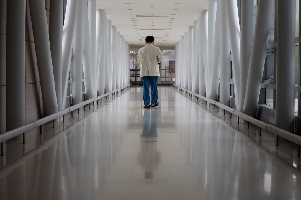 A medical worker walks down a hallway in a hospital in Seoul. South Korea has among the lowest ratios of doctors in the developed world. Photo: EPA-EFE/Yonhap