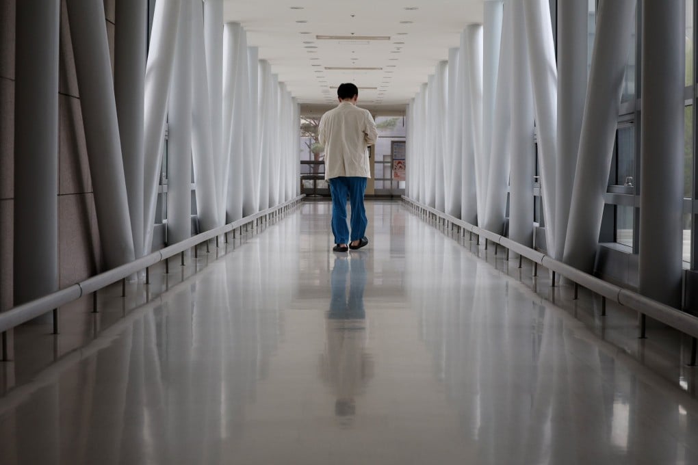 A medical worker walks down a hallway in a hospital in Seoul. South Korea has among the lowest ratios of doctors in the developed world. Photo: EPA-EFE/Yonhap