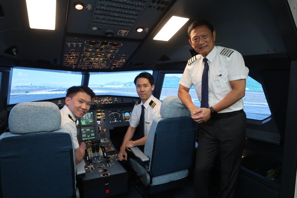 Cadet pilot programme graduates Fred Chan (left) and Tyle Tang (centre), alongside captain Jack Ip, director of flight training and engineering at the Hong Kong International Aviation Academy. Photo: Edmond So