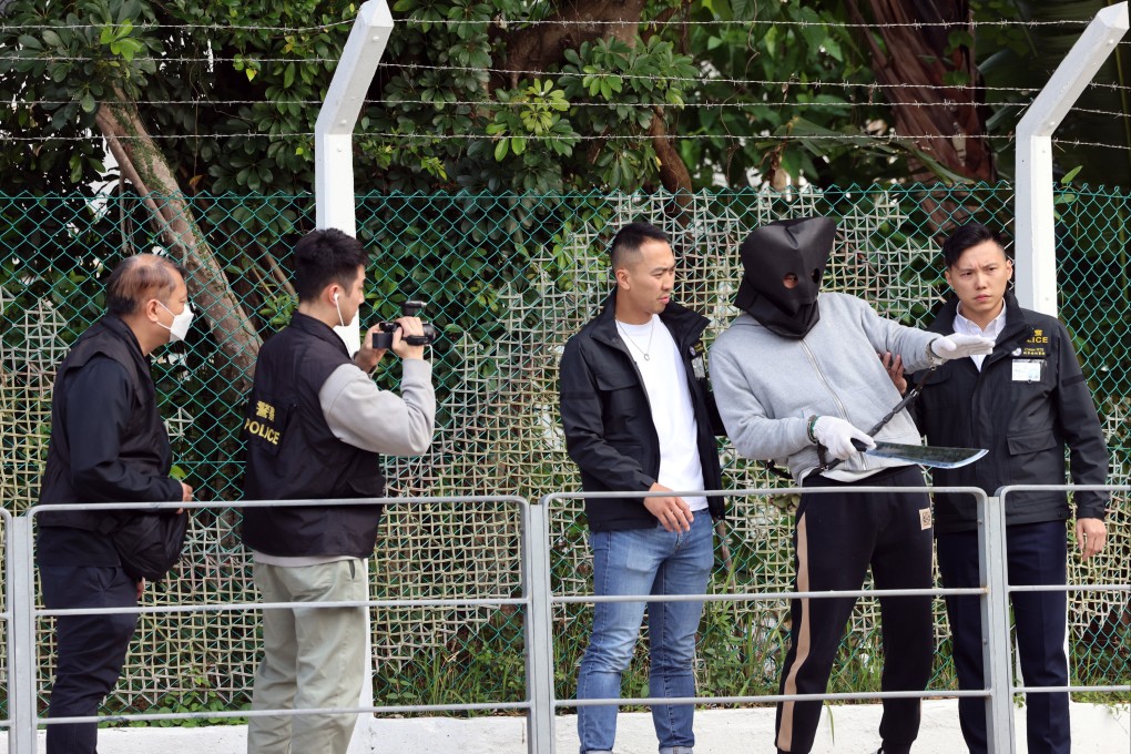 One of the suspects is brought to Fo Tan for a reconstruction of the crime in a previous arrangement. Photo: Jelly Tse