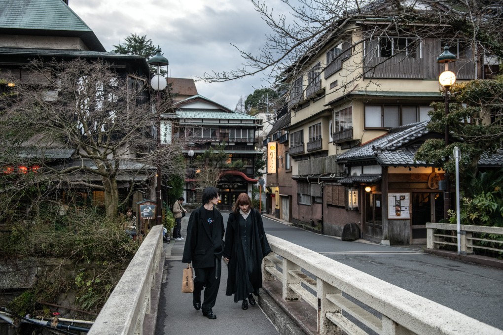 A couple walks over a bridge in the Japanese resort town of Hakone. China has advised its citizens to avoid travelling to Japan amid a diplomatic row between the two countries. Photo: Getty Images