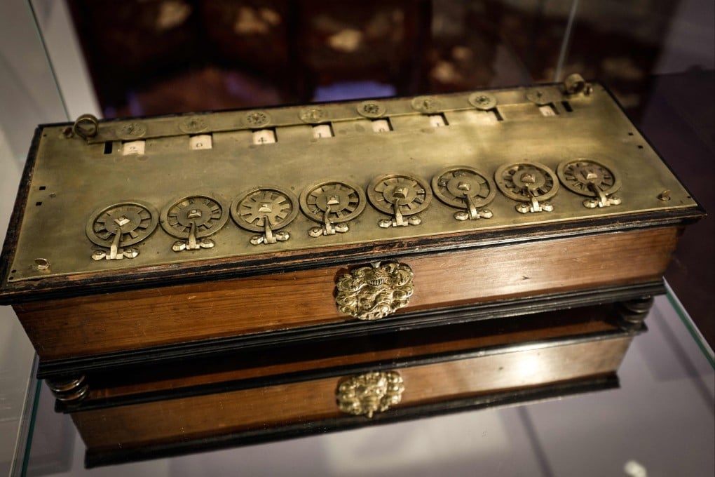 La Pascaline, the first mechanical calculating machine is displayed at Christie’s auction house in Paris. Photo: AFP