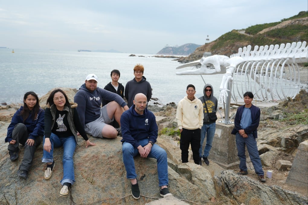 Marine researchers and staff of the Swire Institute of Marine Science with the new replica at Cape D’Aguilar. Photo: Sam Tsang