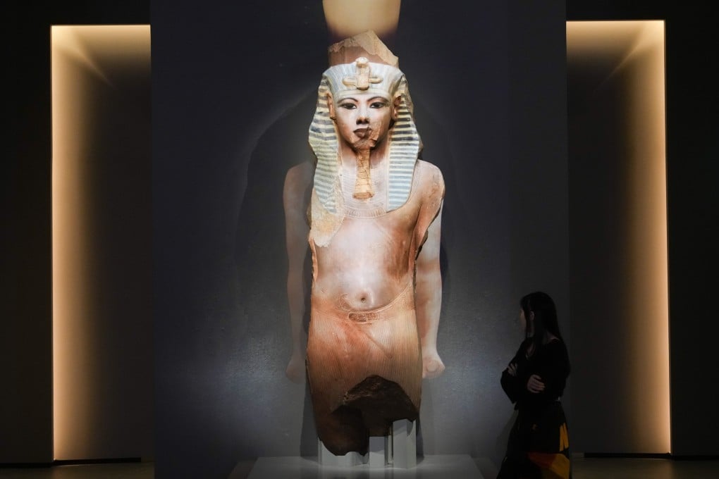 A statue of Tutankhamun is seen at the “Ancient Egypt Unveiled: Treasures from Egyptian Museums” exhibition at the Hong Kong Palace Museum. The statue has been made “whole” with special projection-mapping technology. Photo: Sam Tsang
