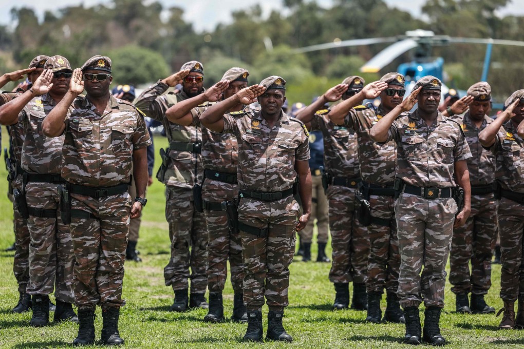 Members of the South African Presidential Protection Service salute during the Integrated Law Enforcement parade near the Nasrec Expo Centre in Johannesburg. Photo: AFP