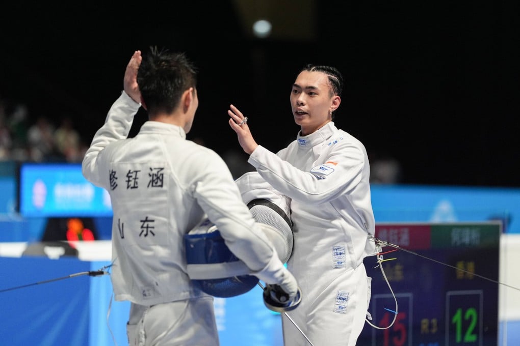 Cedric Ho (right) was knocked out of the individual event by Xiu Yuhan of Shandong on Monday.