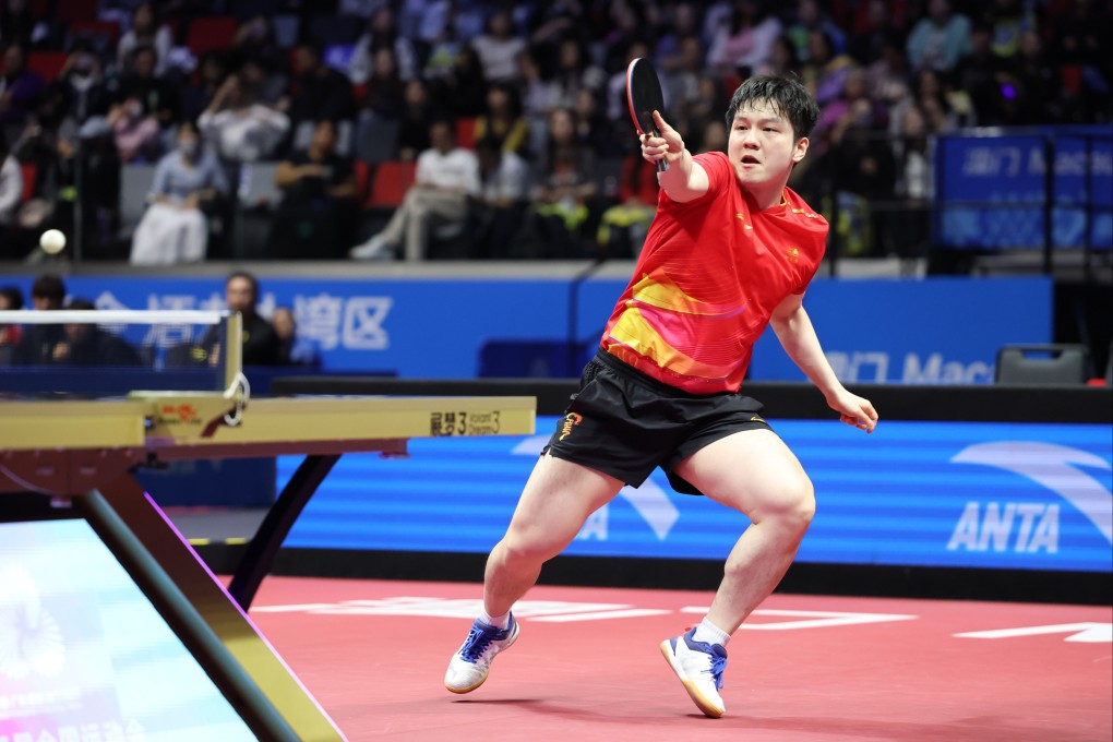 Fan Zhendong of Shanghai hits a return against Liang Jingkun of Hebei during their team event quarter-final in the National Games in Macau on Tuesday. Photo: Xinhua